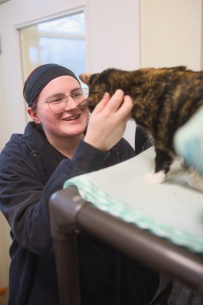 Caitlin gives Jojo some love on a tour of the sanctuary